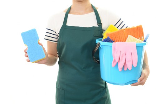Professional curtain cleaning service removing dust from hanging drapes