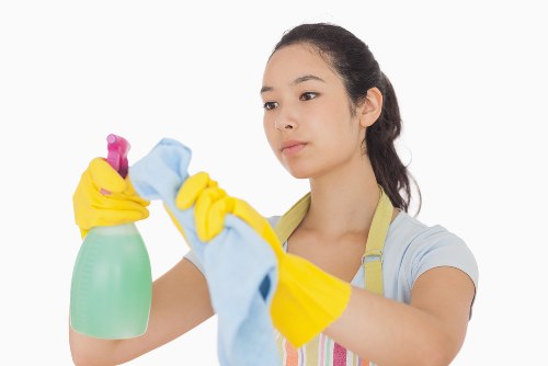 Technician performing deep upholstery cleaning on a sofa