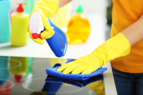 Technician performing commercial carpet cleaning in an office