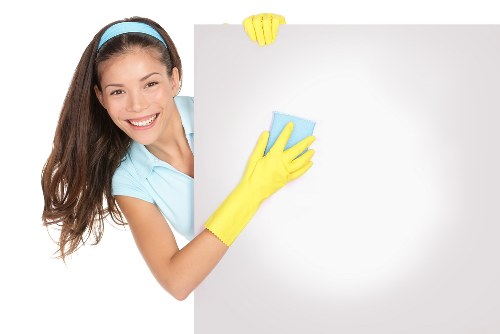 Blotting a fresh stain on fabric with a clean cloth